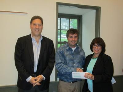 Frank Murphy and Noelle Barbone present a check to the Civic Association